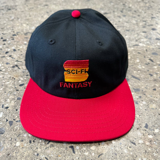 Black hat with red brim with gradient red/yellow S in the center of the hat