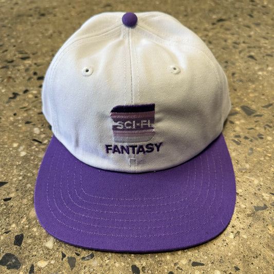 white hat with purple bill with lavender/dark purple gradient S in the center