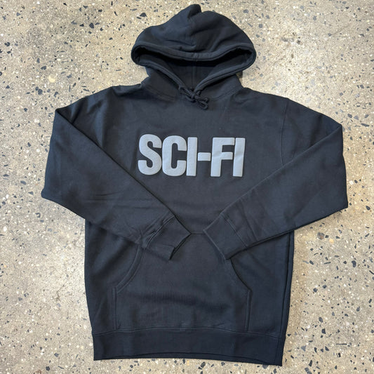 black sweatshirt with sci-fi printed in grey letters across the center