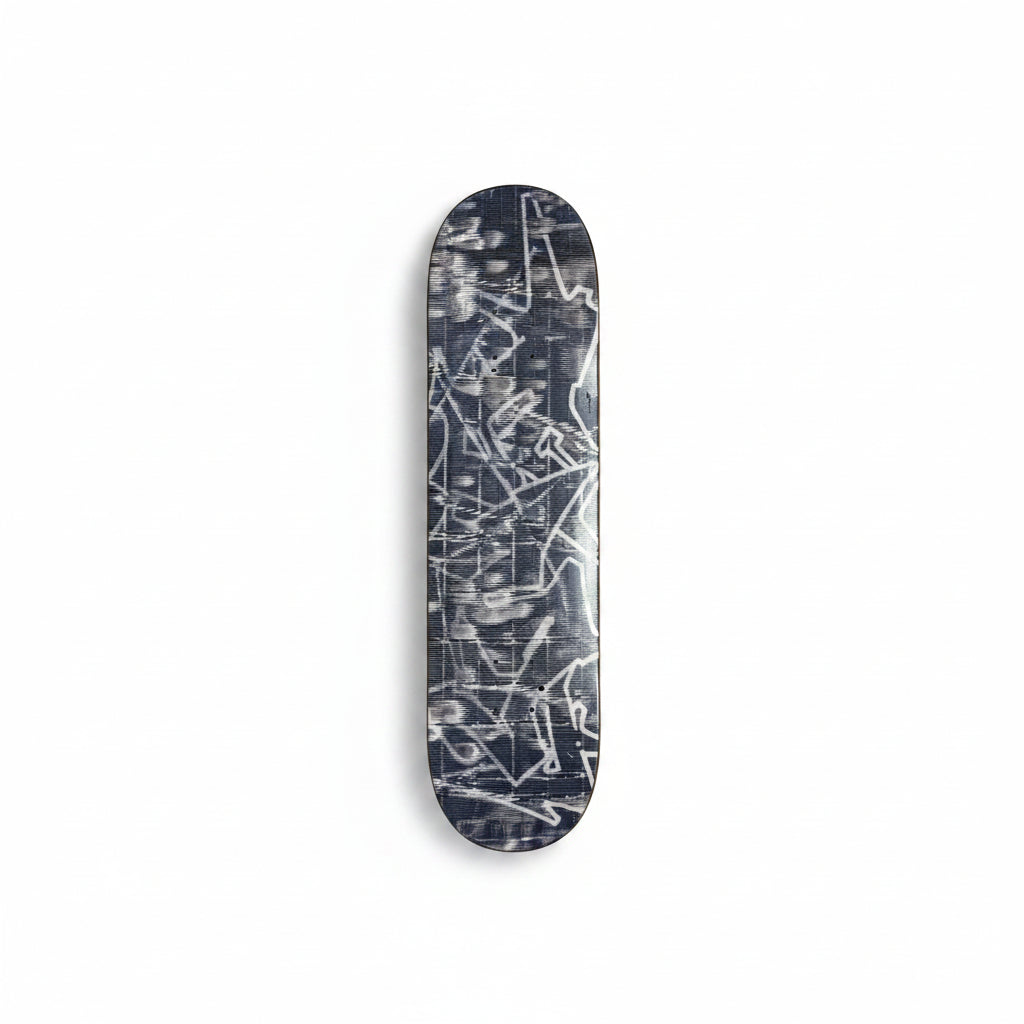 Skateboard deck with abstract design on a white surface