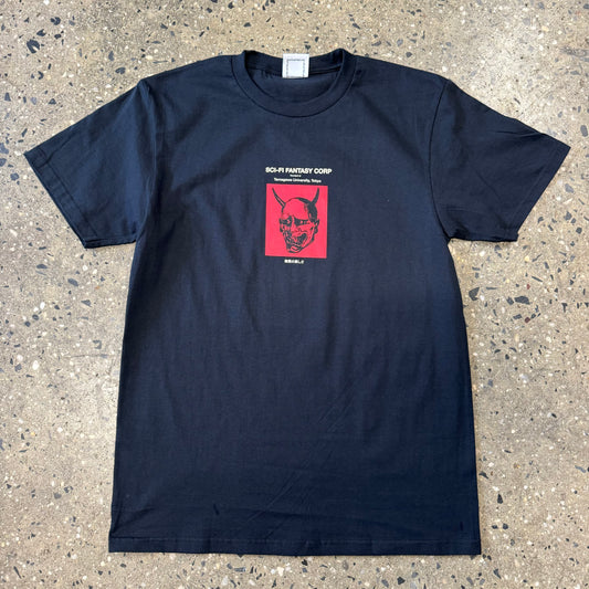 black t shirt with small red image of an evil mask  in the center with white text