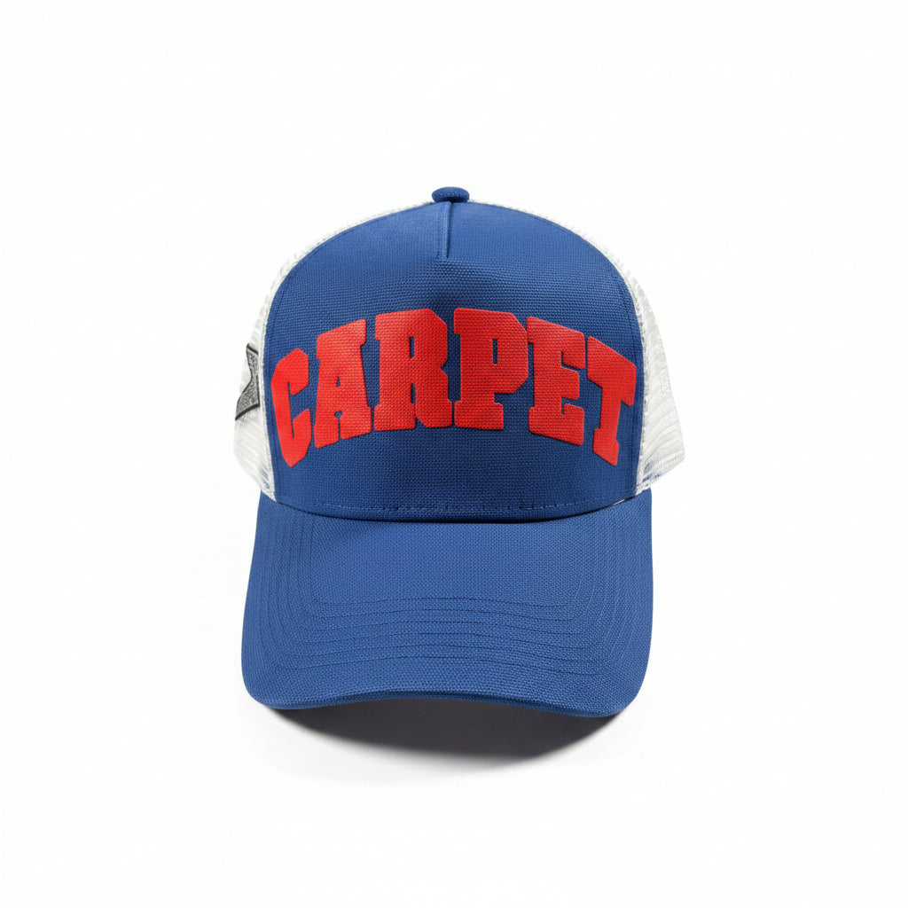 Blue cap with red 'CARPET' text on a white surface