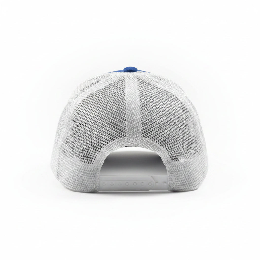 White mesh cap with blue top on a white surface