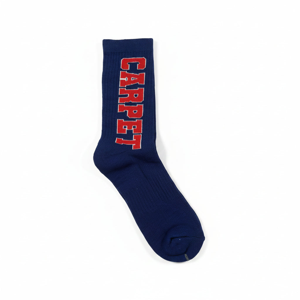 Blue sock with red text 'CARPET' on a white surface