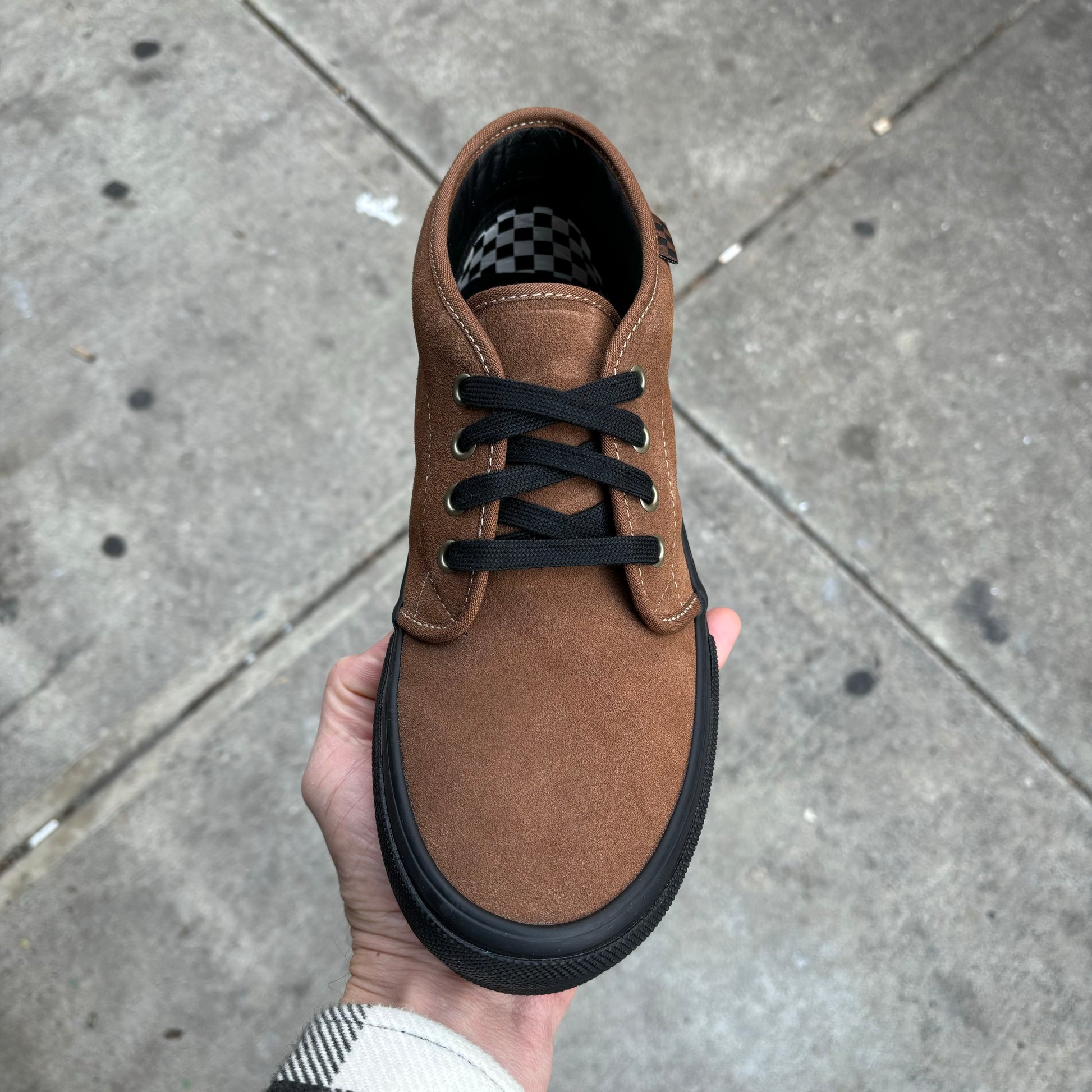 top down view of brown suede with black sole skateboard sneaker