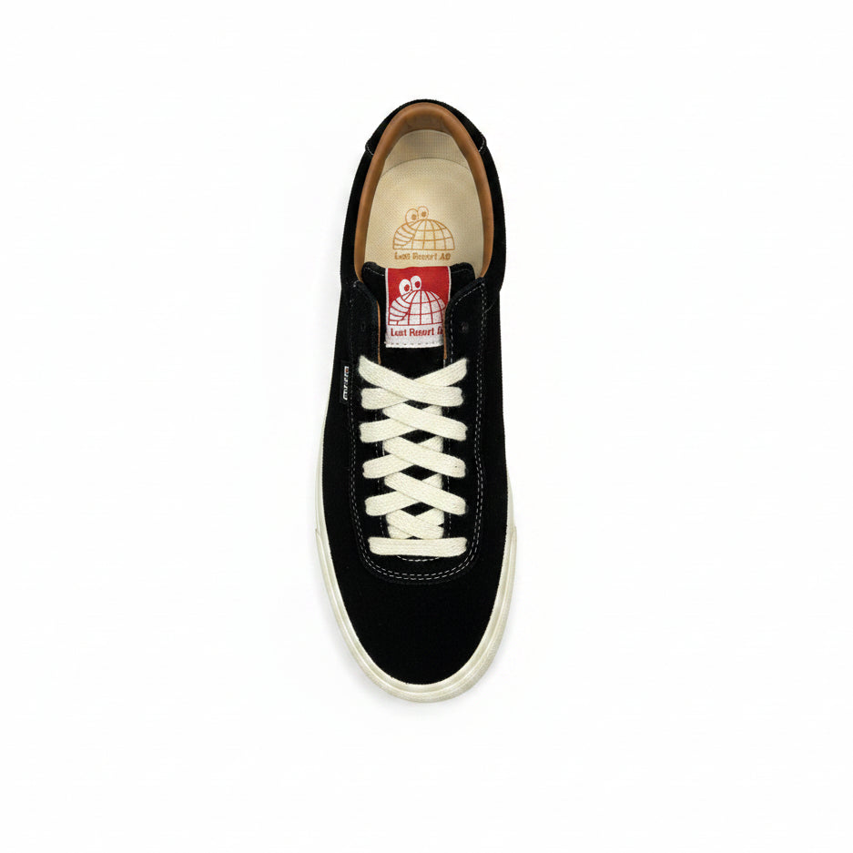 Black sneaker with white laces on a white background