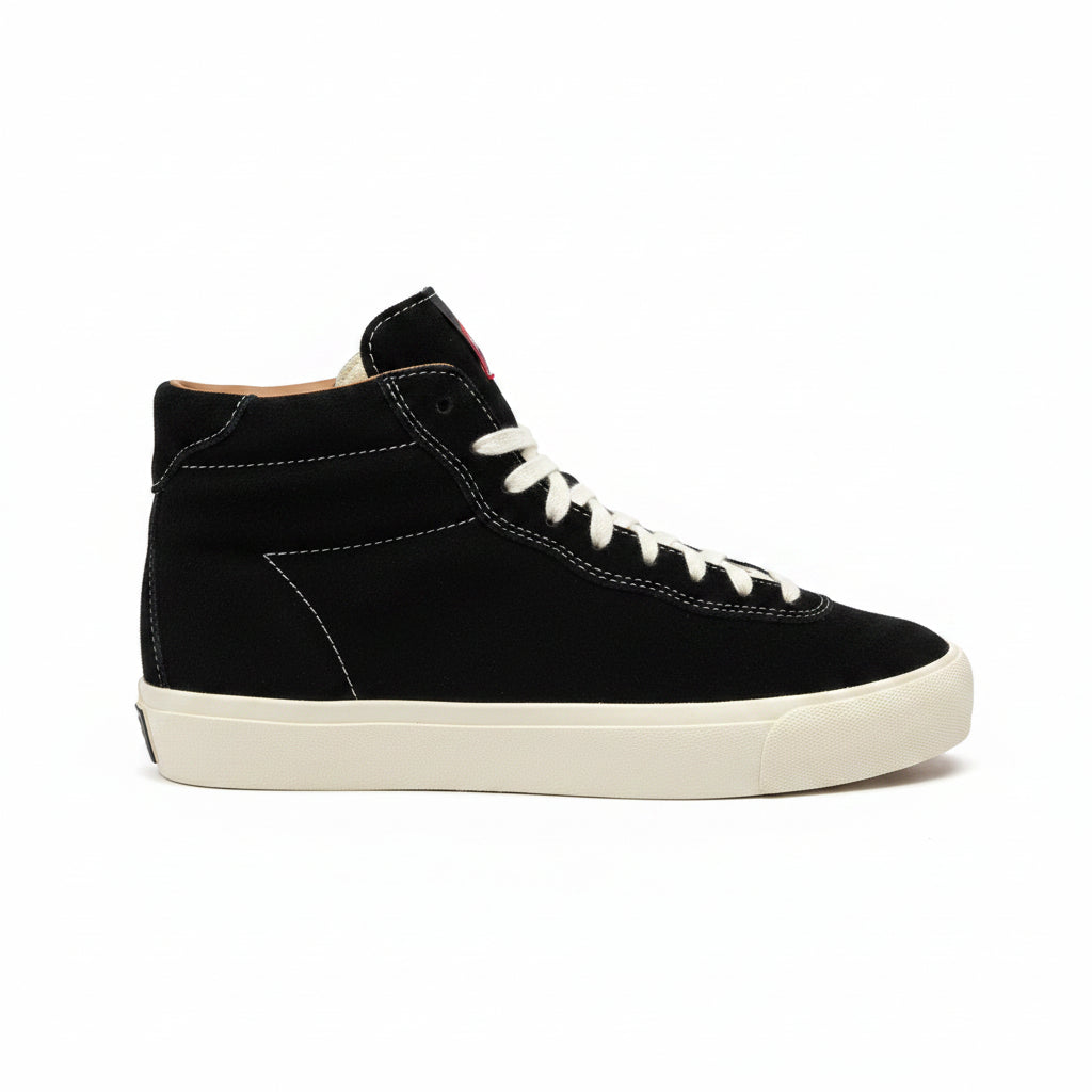 Black high-top sneaker with white laces on a white background