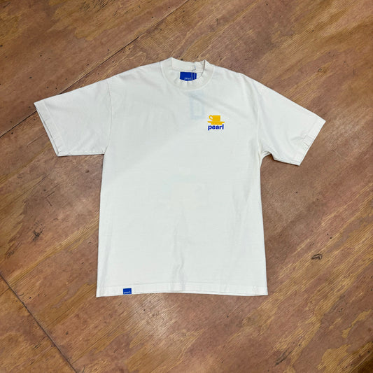 View of front of tee with left chest teacup graphic, and PEARL logo 