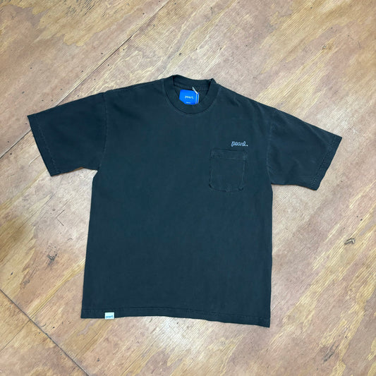 top down photo of black washed pocket tee with embroidered PEARL above pocket