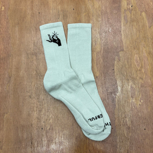 view of taupe socks with logo on ankle and toe