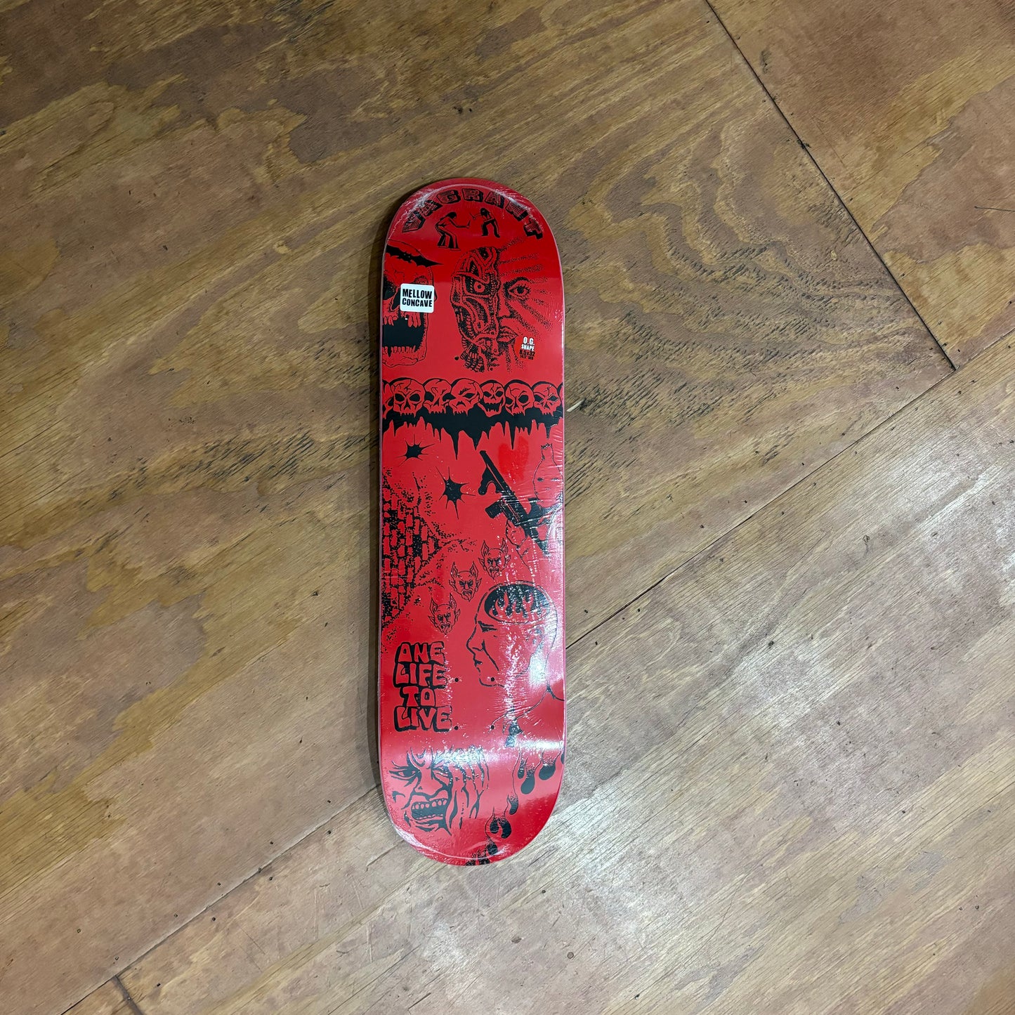 red hand drawn graphic on skateboard deck