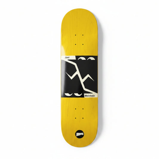 Yellow skateboard deck with black and white graphics on a white surface