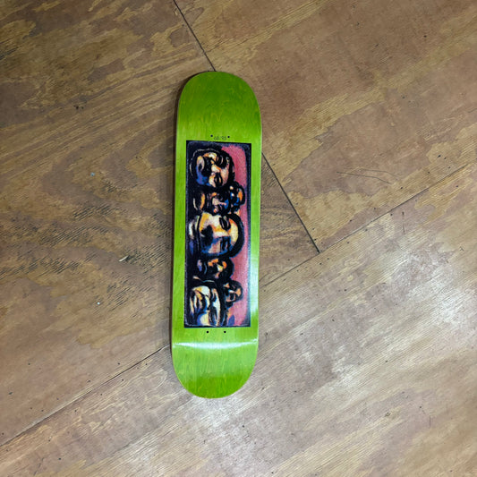 hand screened graphic of multiple heads on a skateboard deck