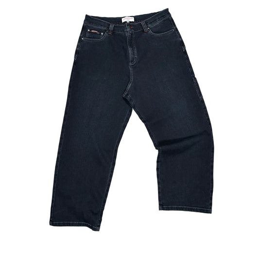 Blue jeans on a white surface 