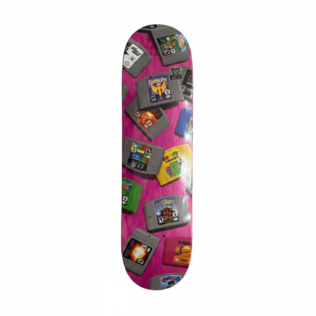 Skateboard deck with retro game cartridge design on a white surface