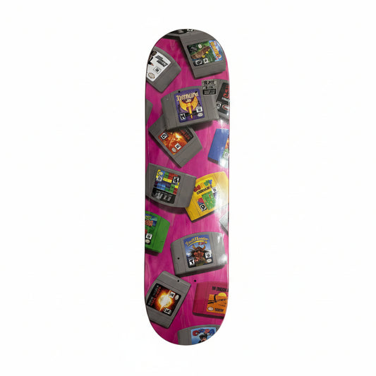 Skateboard deck with retro game cartridge design on a white surface