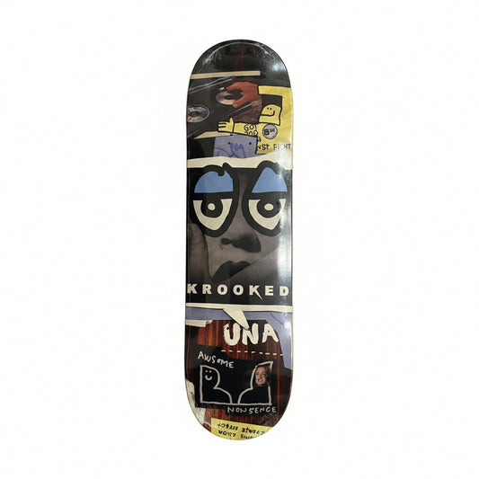 Skateboard deck with artistic design and 'Krooked' branding on a white surface.