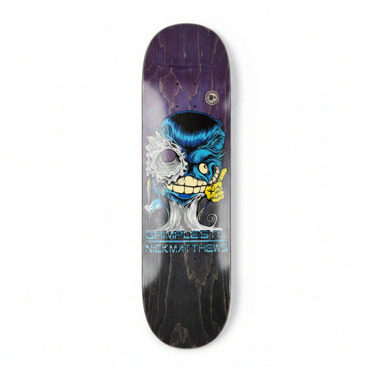Skateboard deck with a graphic design on a white surface