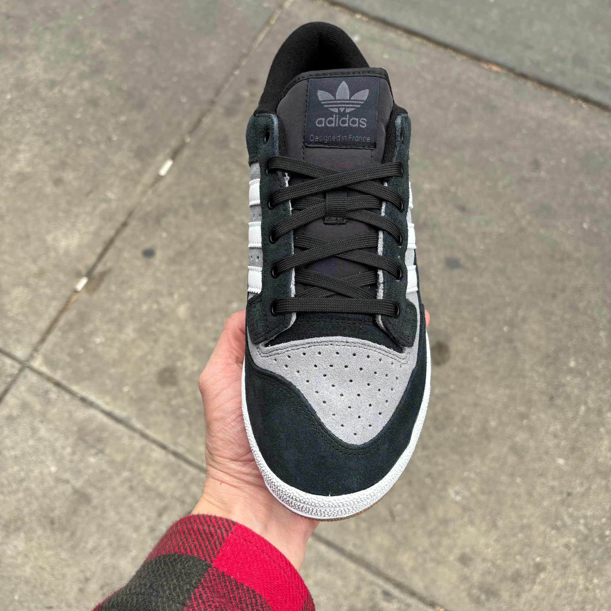 top down view of laces area on black/whitegrey suede skateboard sneaker