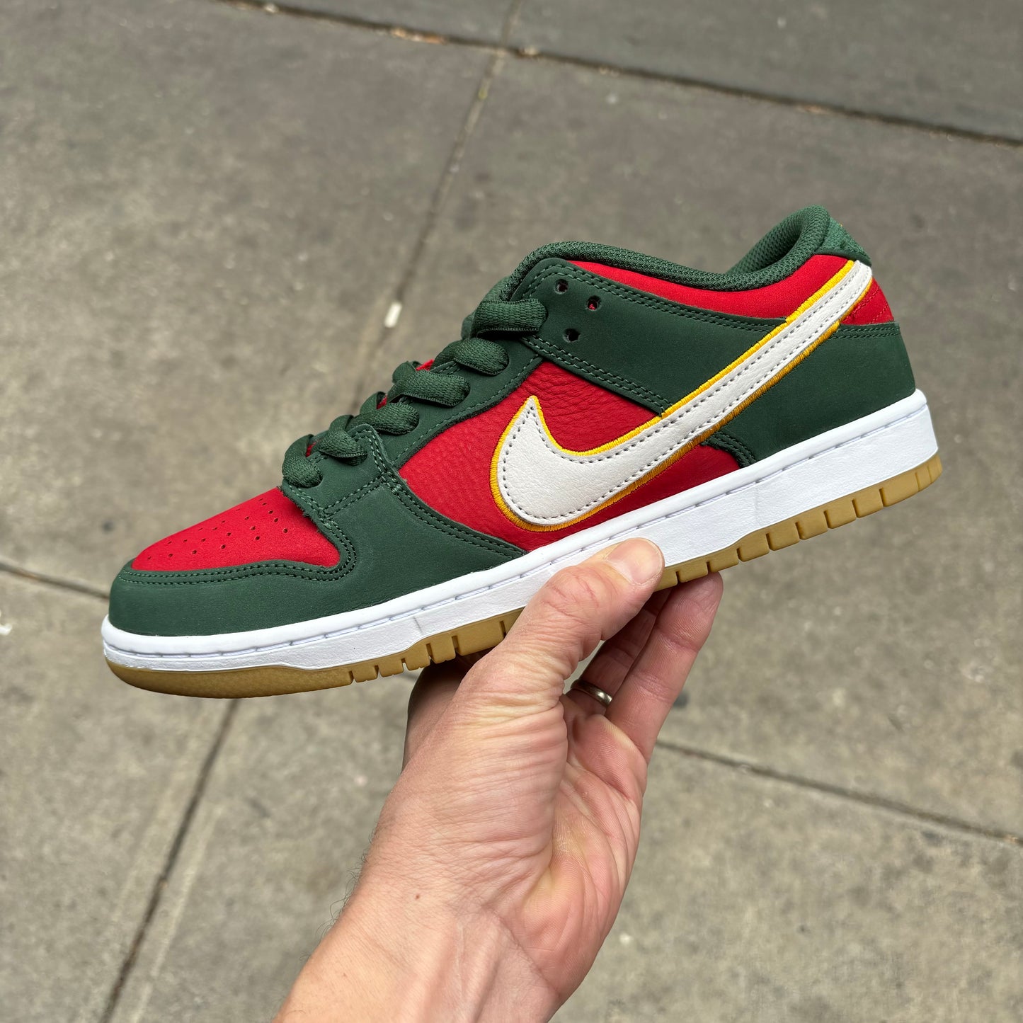 Side view of green and red nike dunk low