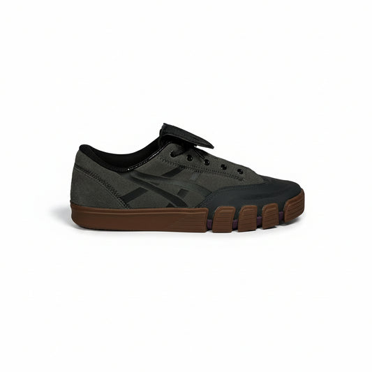 Gray and black sneaker with brown sole on a white background