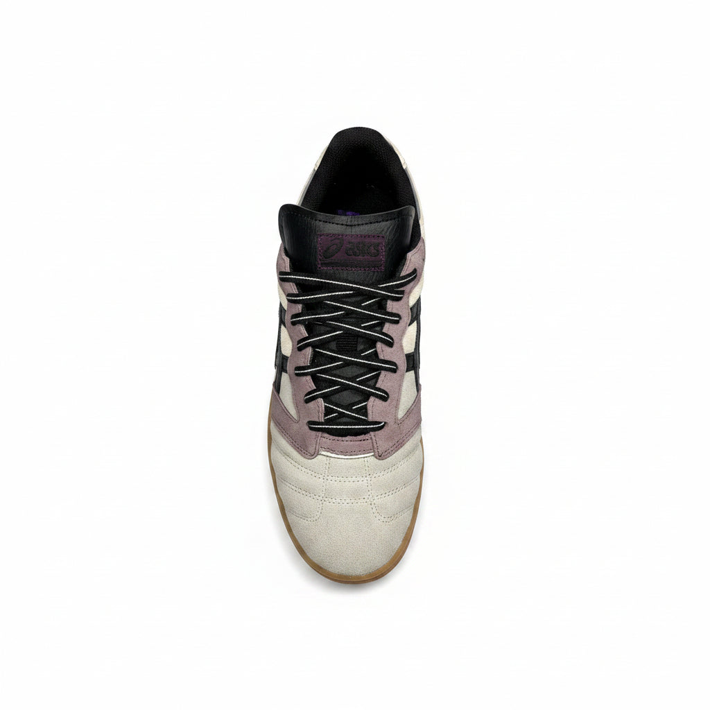 top down view of grey and purple suede Sneaker on a white background