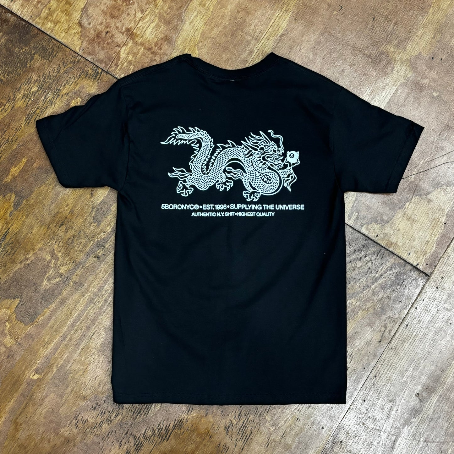 rear image of dragon graphic on black t-shirt