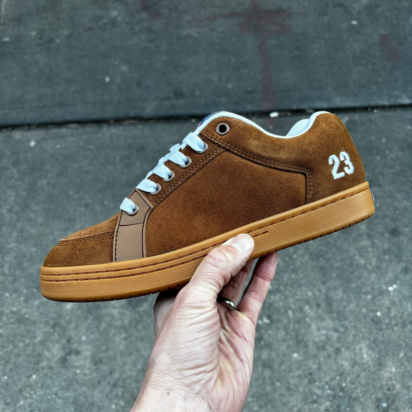 side view of brown suede sal 23 sneaker with white laces