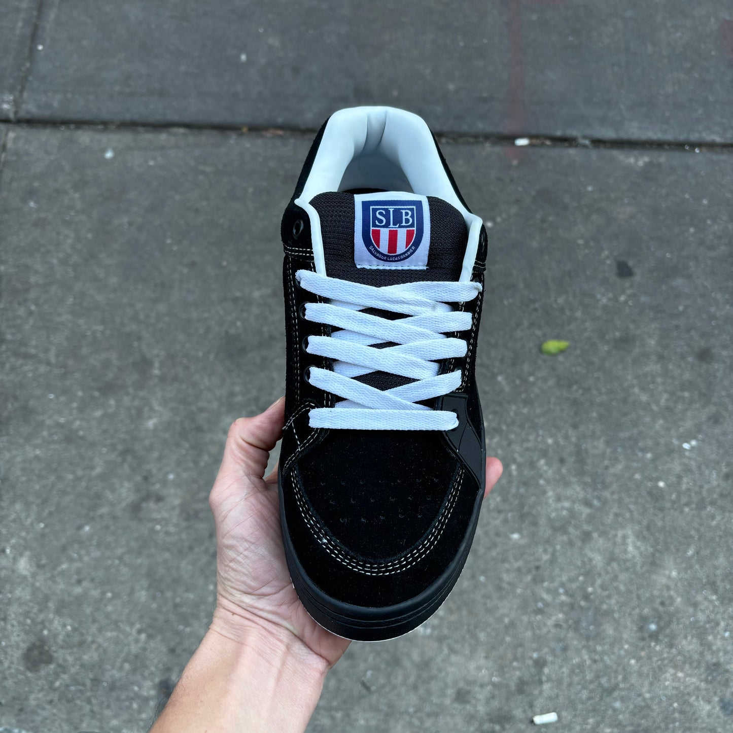 top down view of black and white suede skateboard sneaker