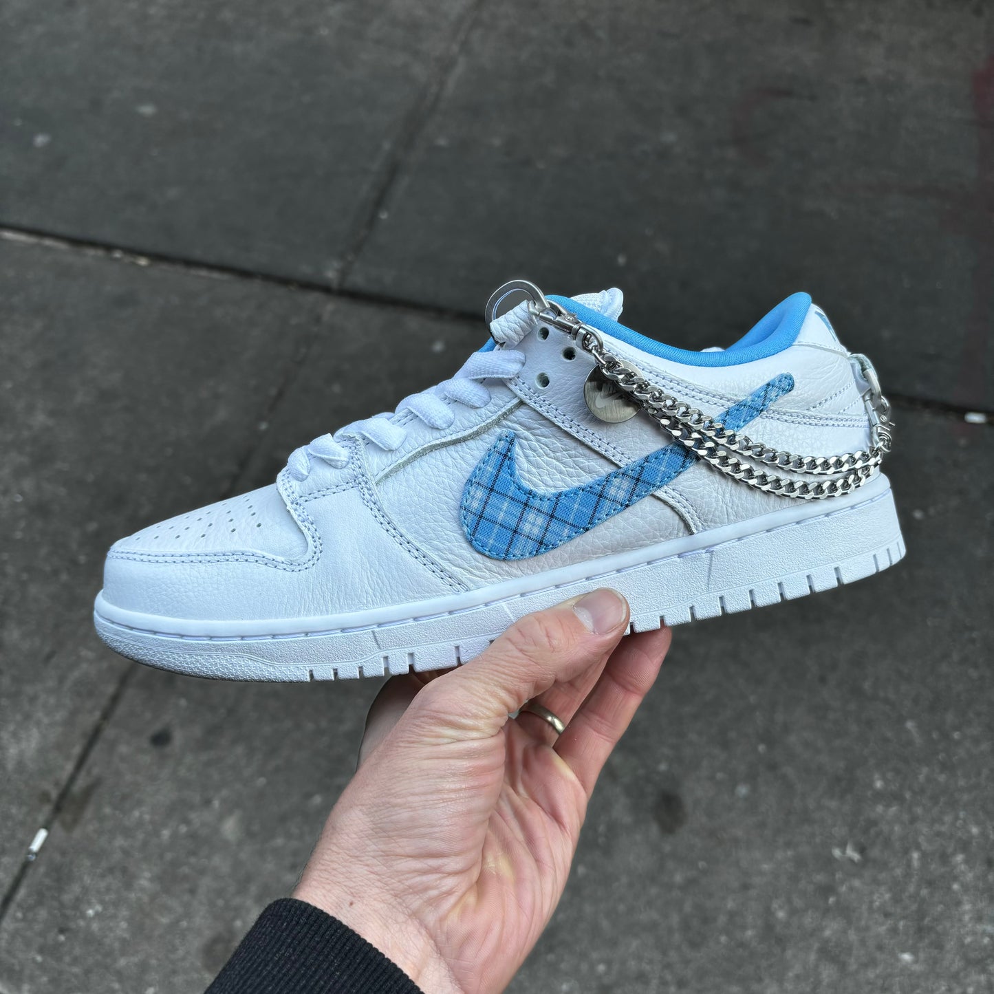 side view of white and blue dunk low pro