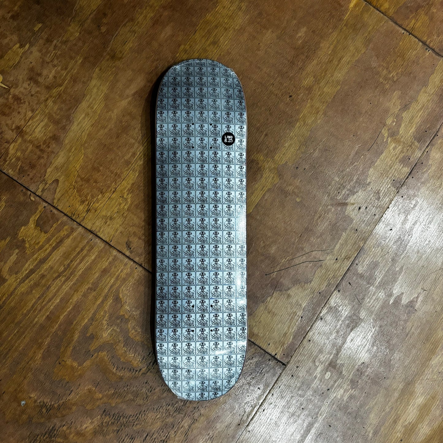 snake pit graphic repeated on skateboard deck