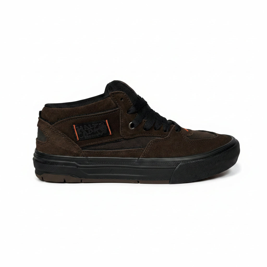 Brown sneaker on a textured surface