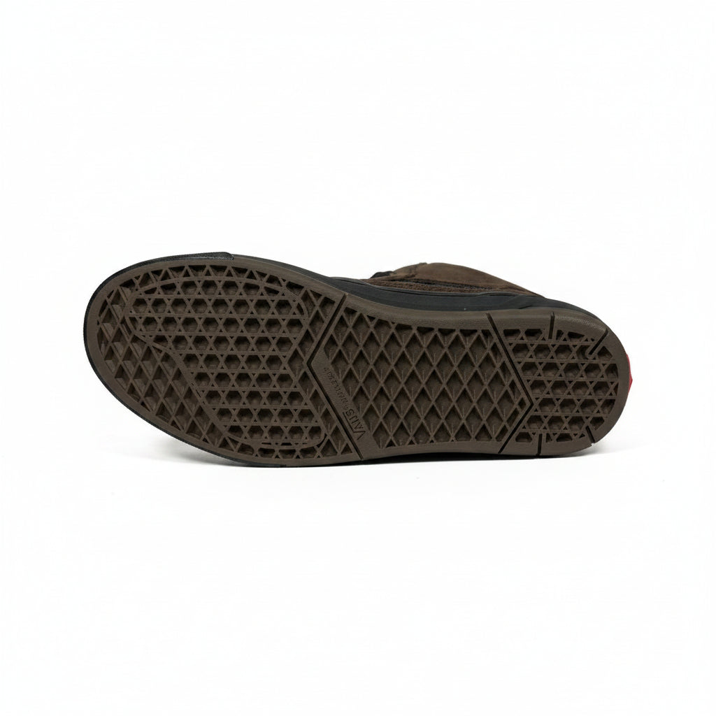 Brown shoe sole with diamond pattern on a white surface