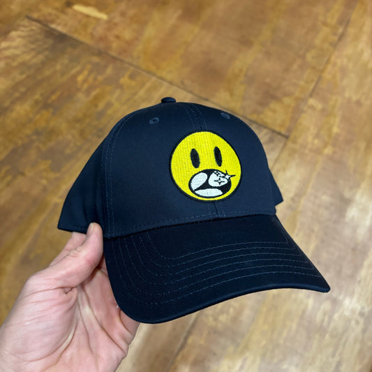 front view of navy hat with yellow embroidered smiley