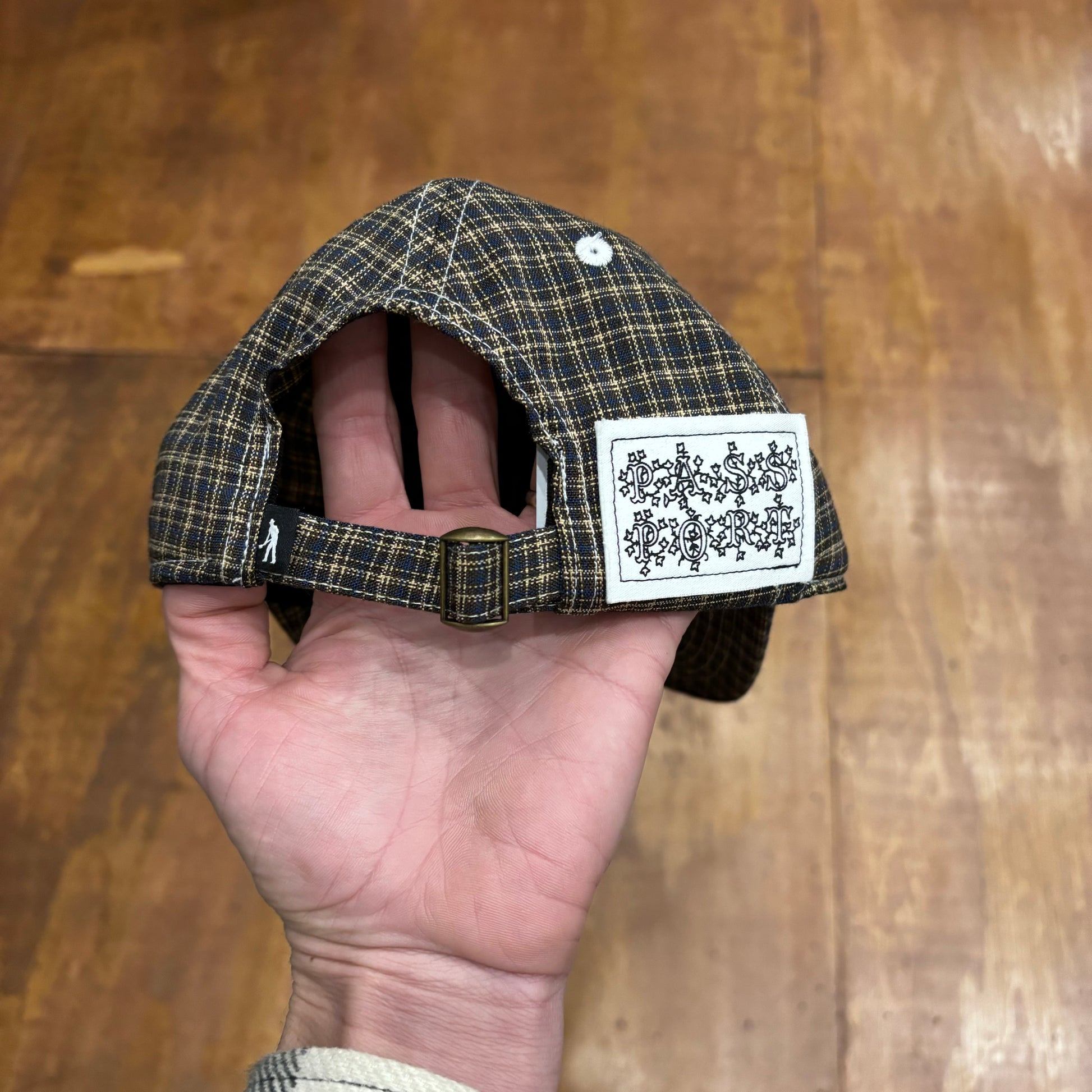 rear view of hat closure with large patch on right side with PASS PORT on patch