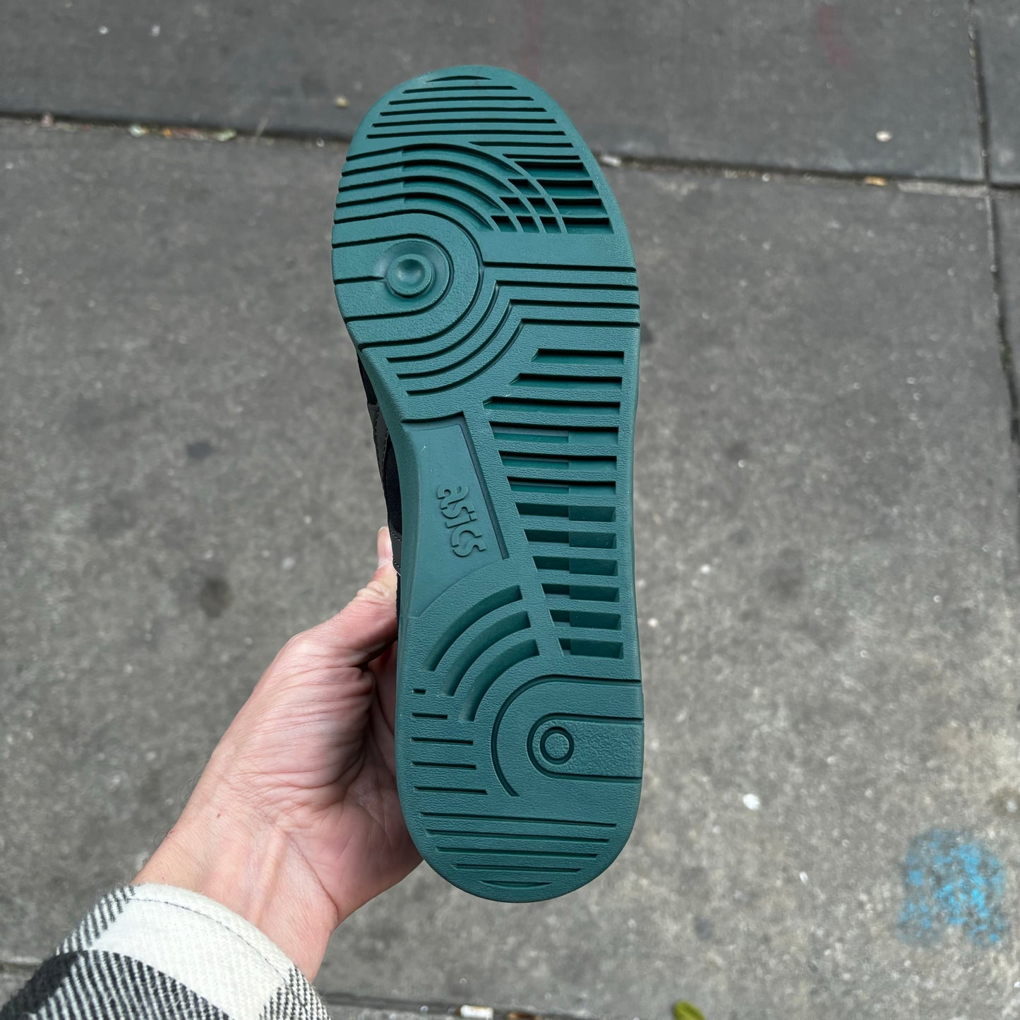 view of green outsole on skateboard sneaker