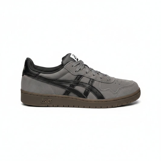 Gray sneaker with black asics stripe on a white textured background
