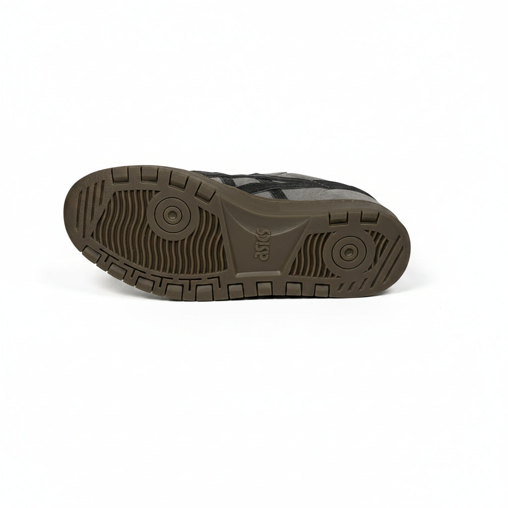 dark brown gum sneaker sole on a white surface