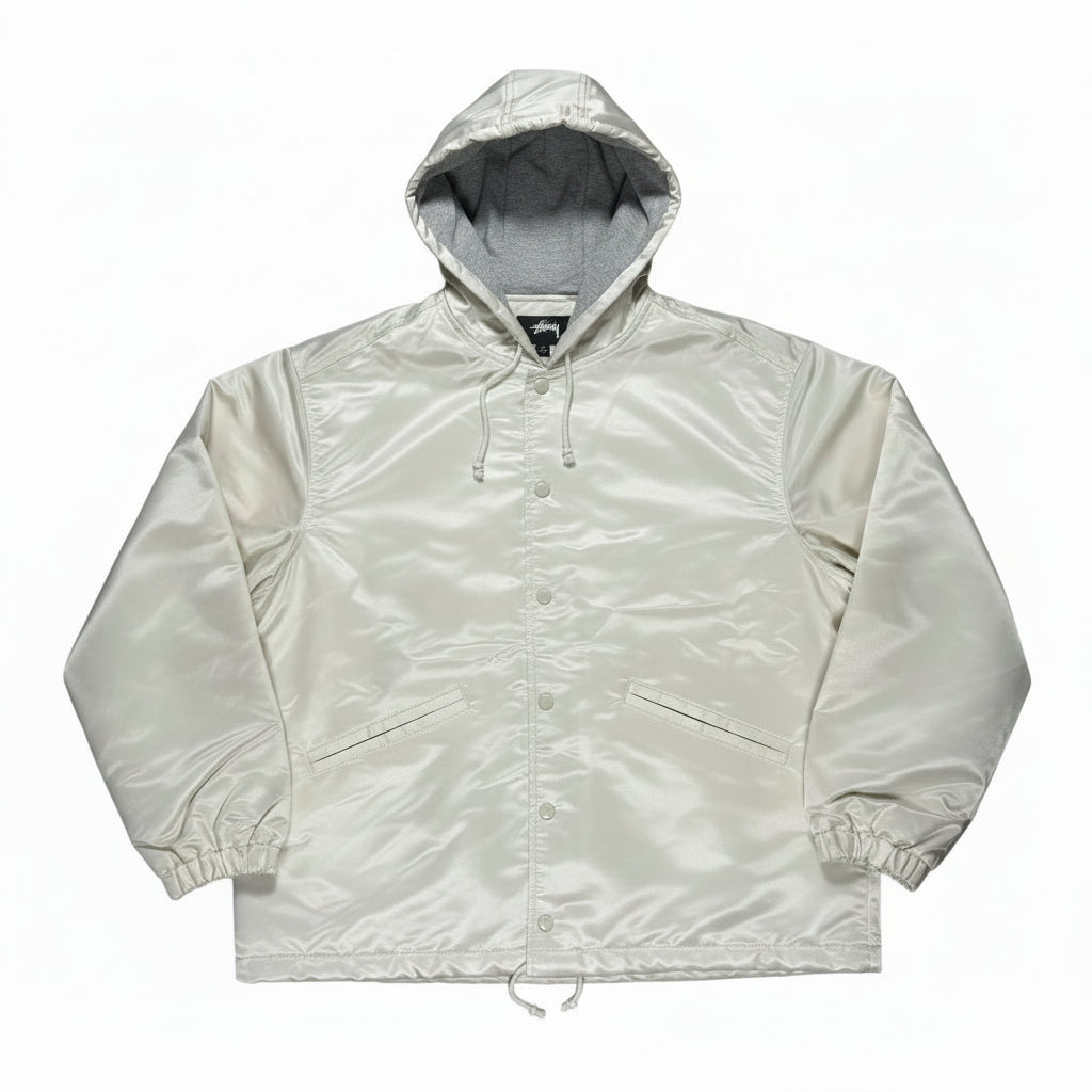 Light-colored coaches jacket on a white background