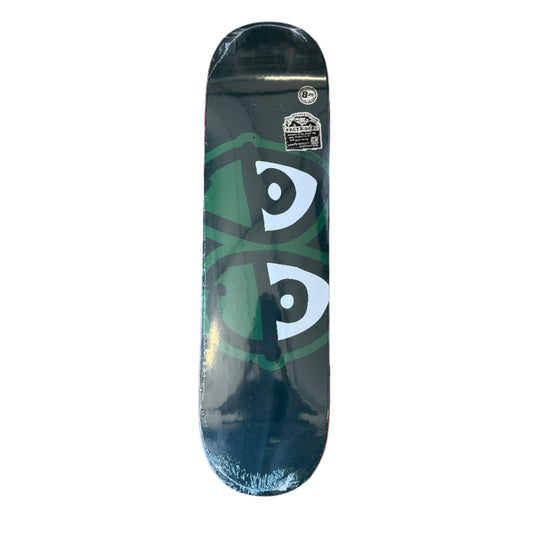 dark green skateboard deck with white eyes 