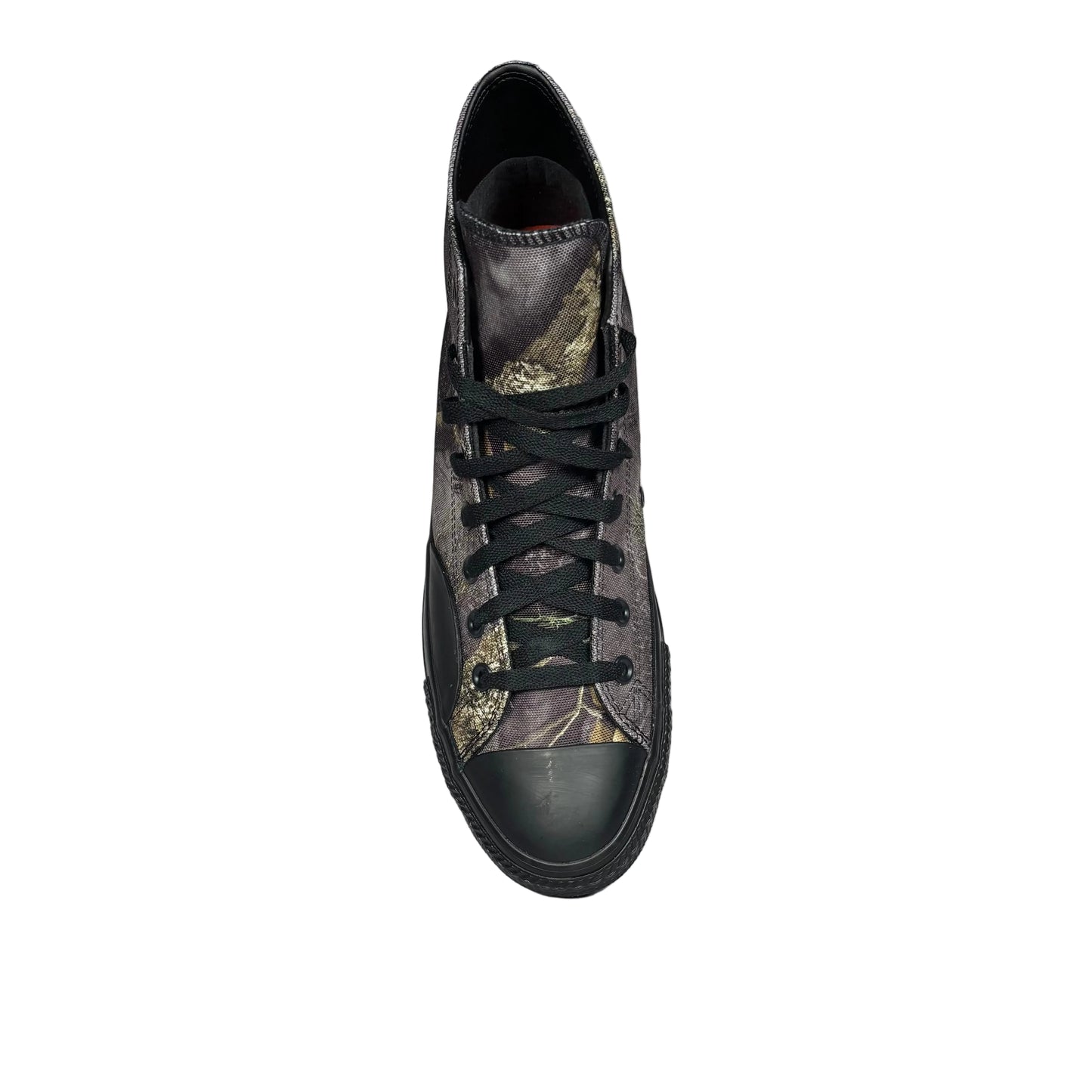 canvas high-top sneaker with camouflage pattern on a white surface