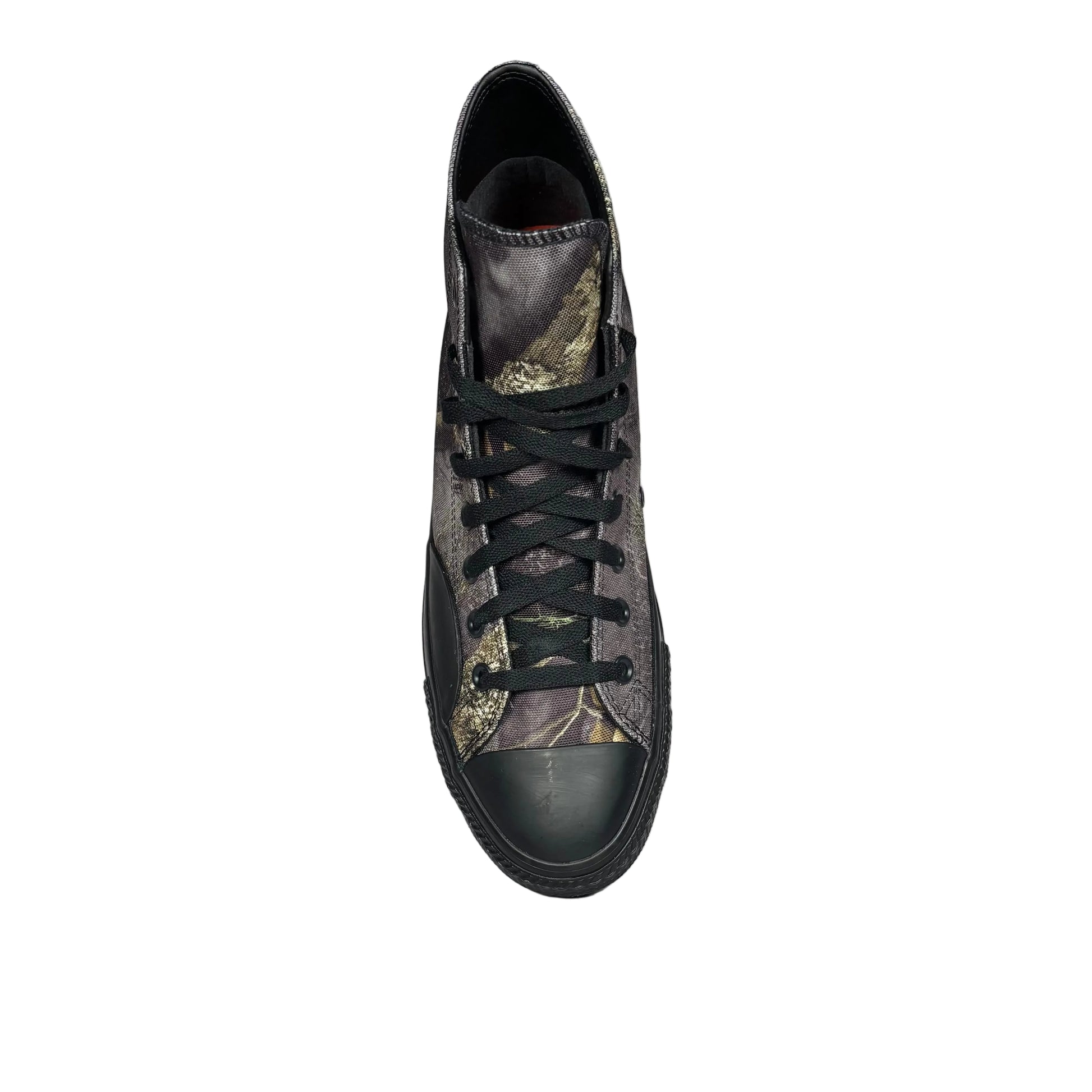 canvas high-top sneaker with camouflage pattern on a white surface