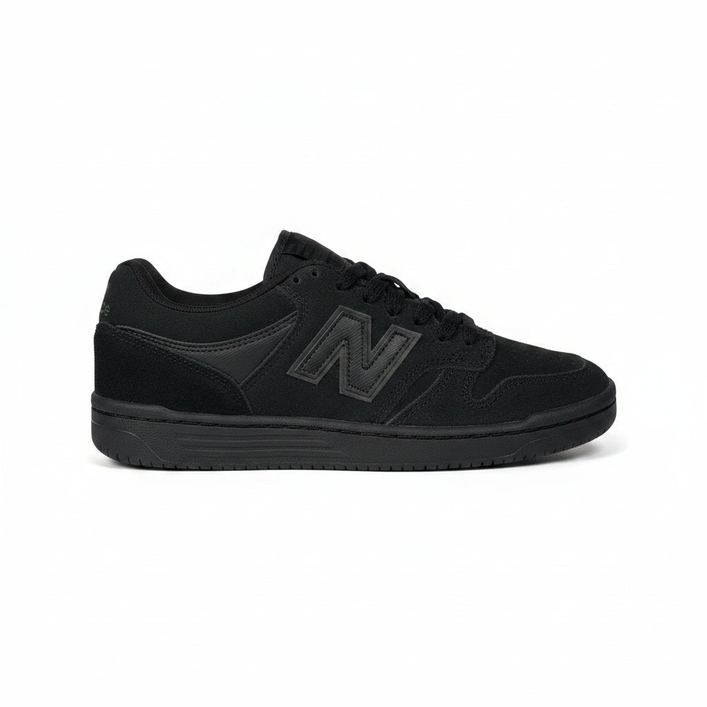 Black sneaker with New Balance logo on a white background