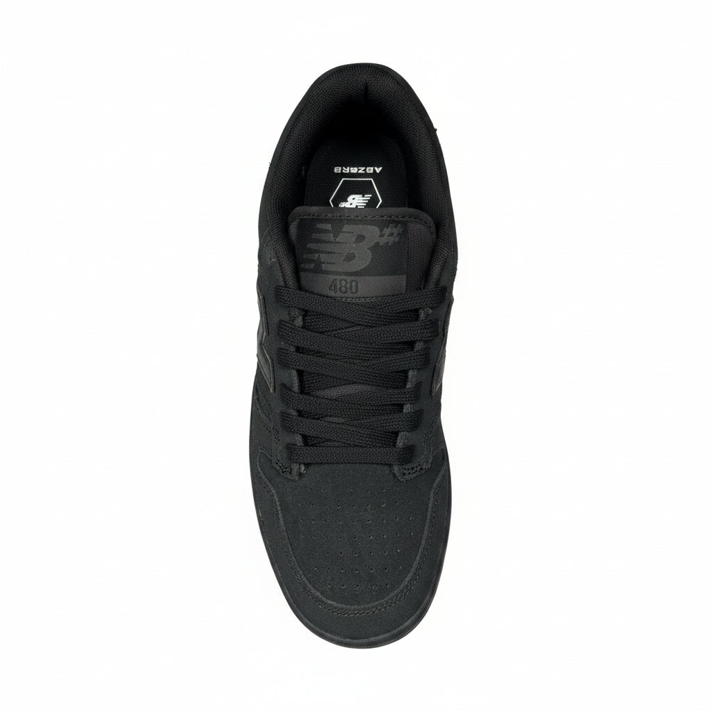 top down view of Black sneaker with brand logo on a white surface
