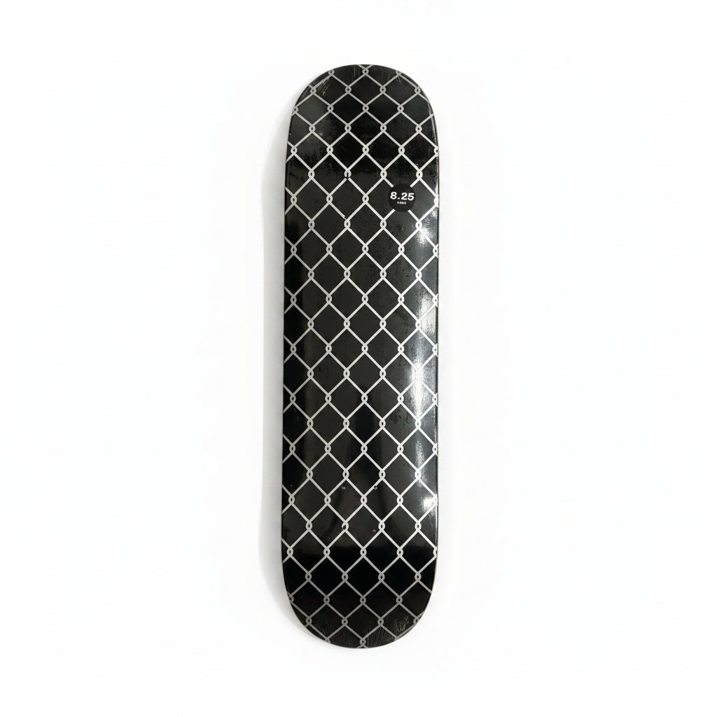 Black diamond-patterned skateboard deck on a white surface
