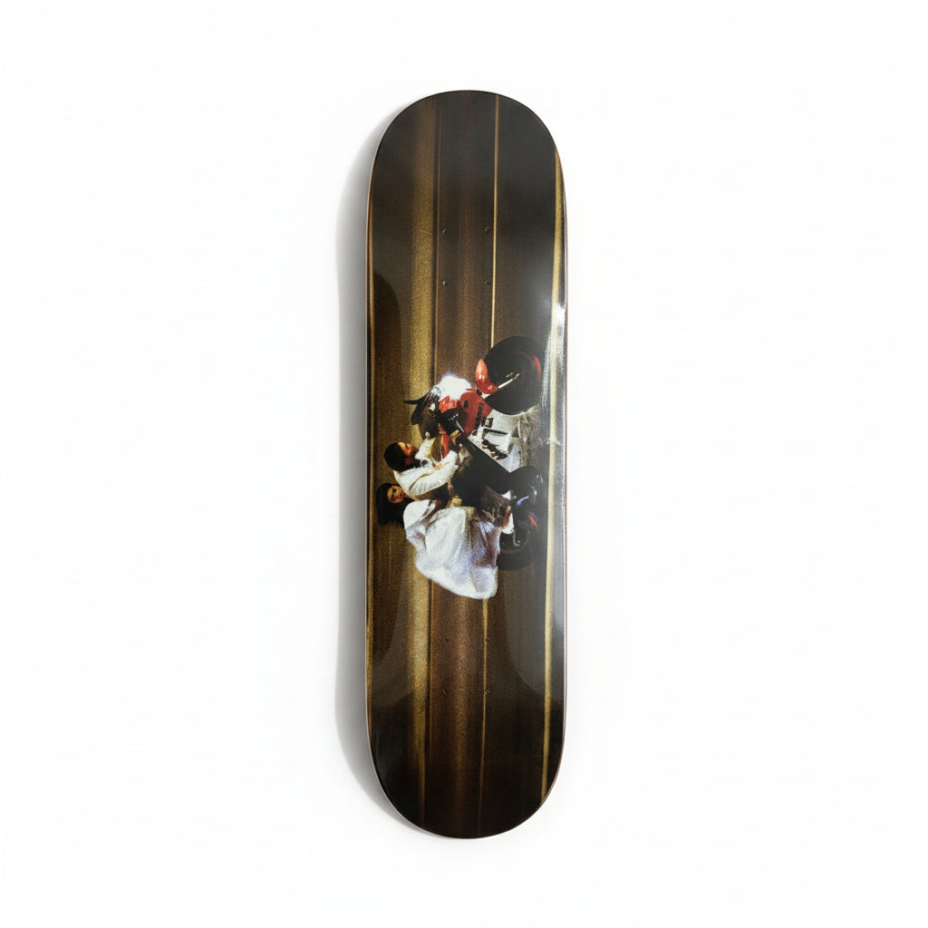 Skateboard deck with a graphic design on a white surface
