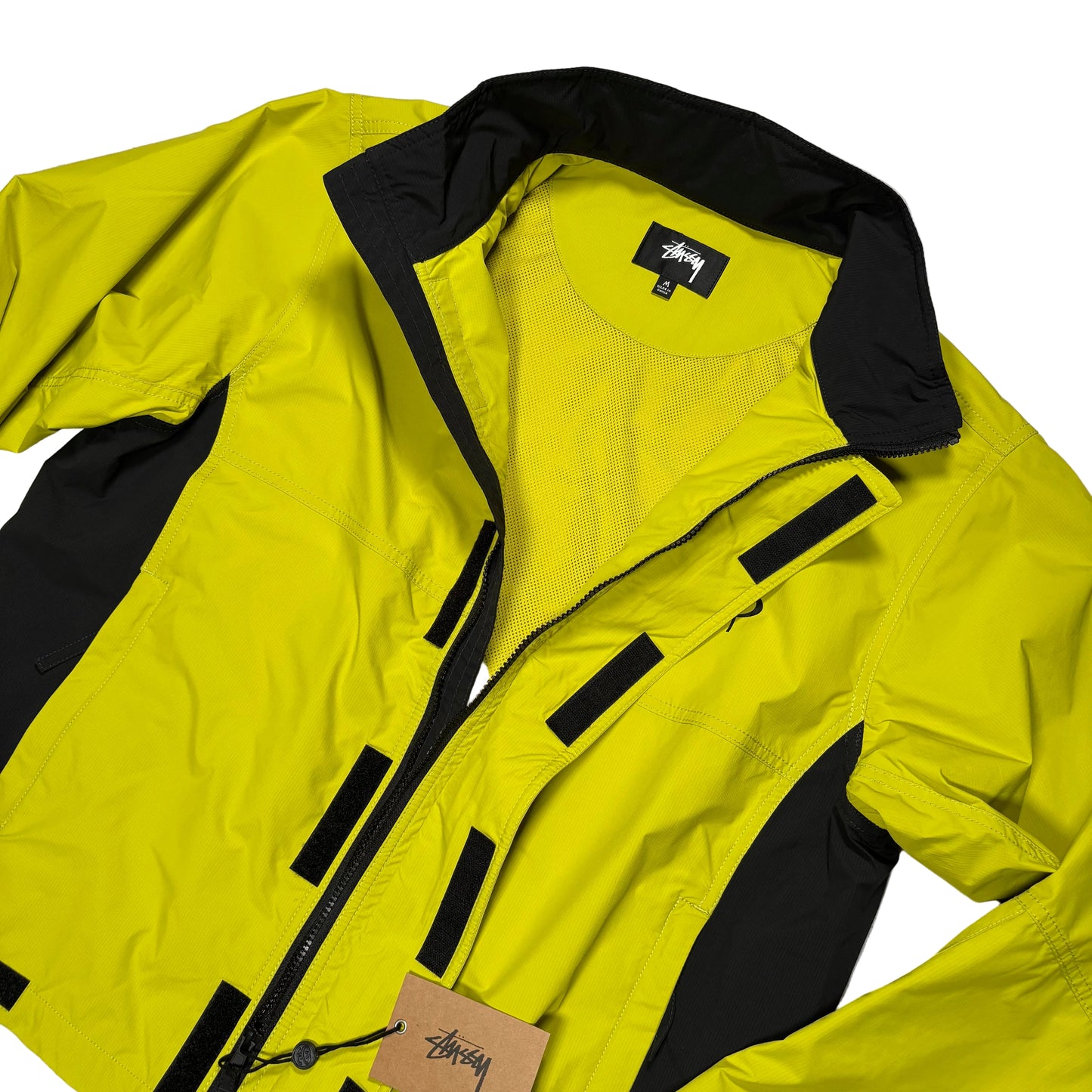 Yellow jacket with black accents on a white surface