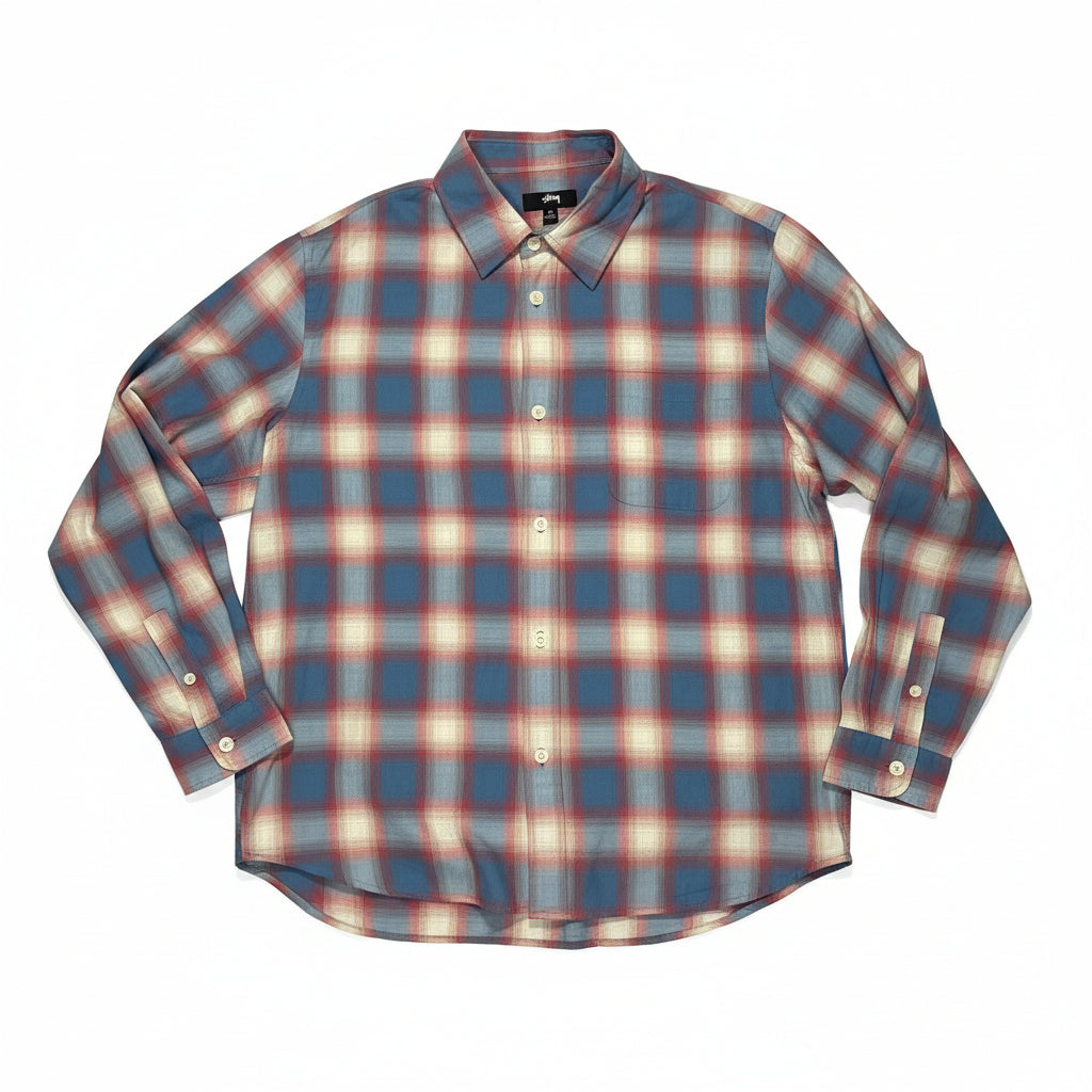 blue, red and white plaid shirt on a white surface 