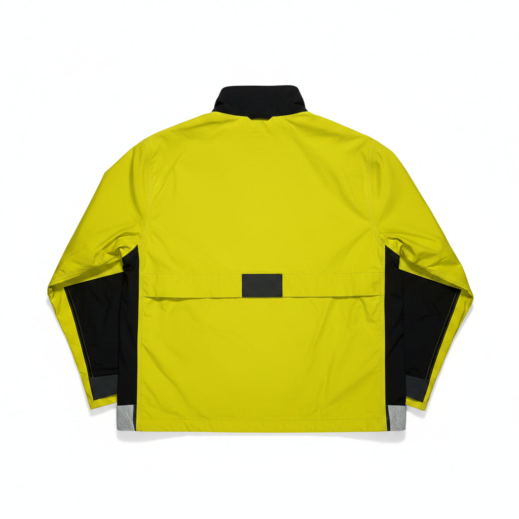 Yellow jacket with black accents on a white surface
