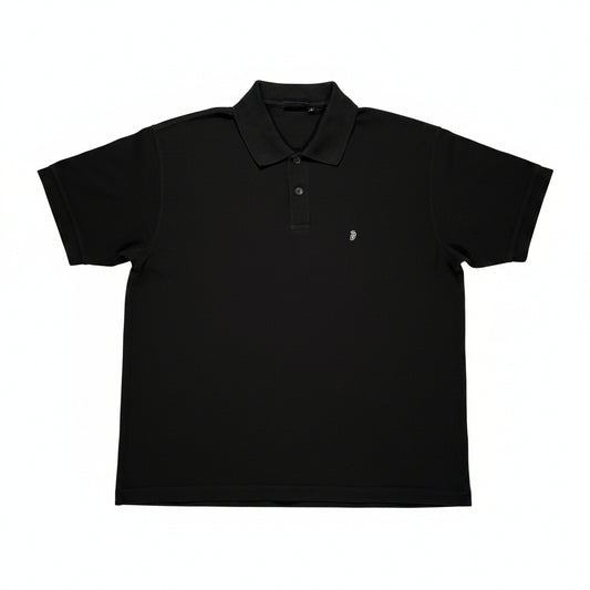 Black polo shirt on a white surface